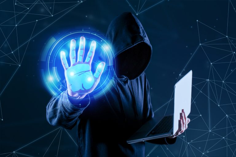 A person holding a laptop in hand and showing his palm for cyber security services