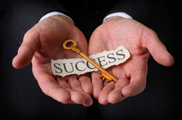 Businessman holding key, symbolizing success.