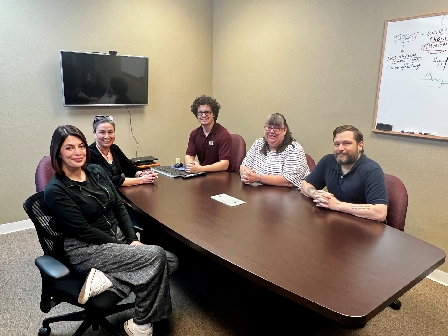LDD Consulting team meeting in conference room discussing IT security planning